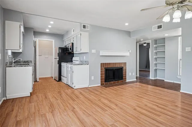 a view of a kitchen with a sink and a kitchen