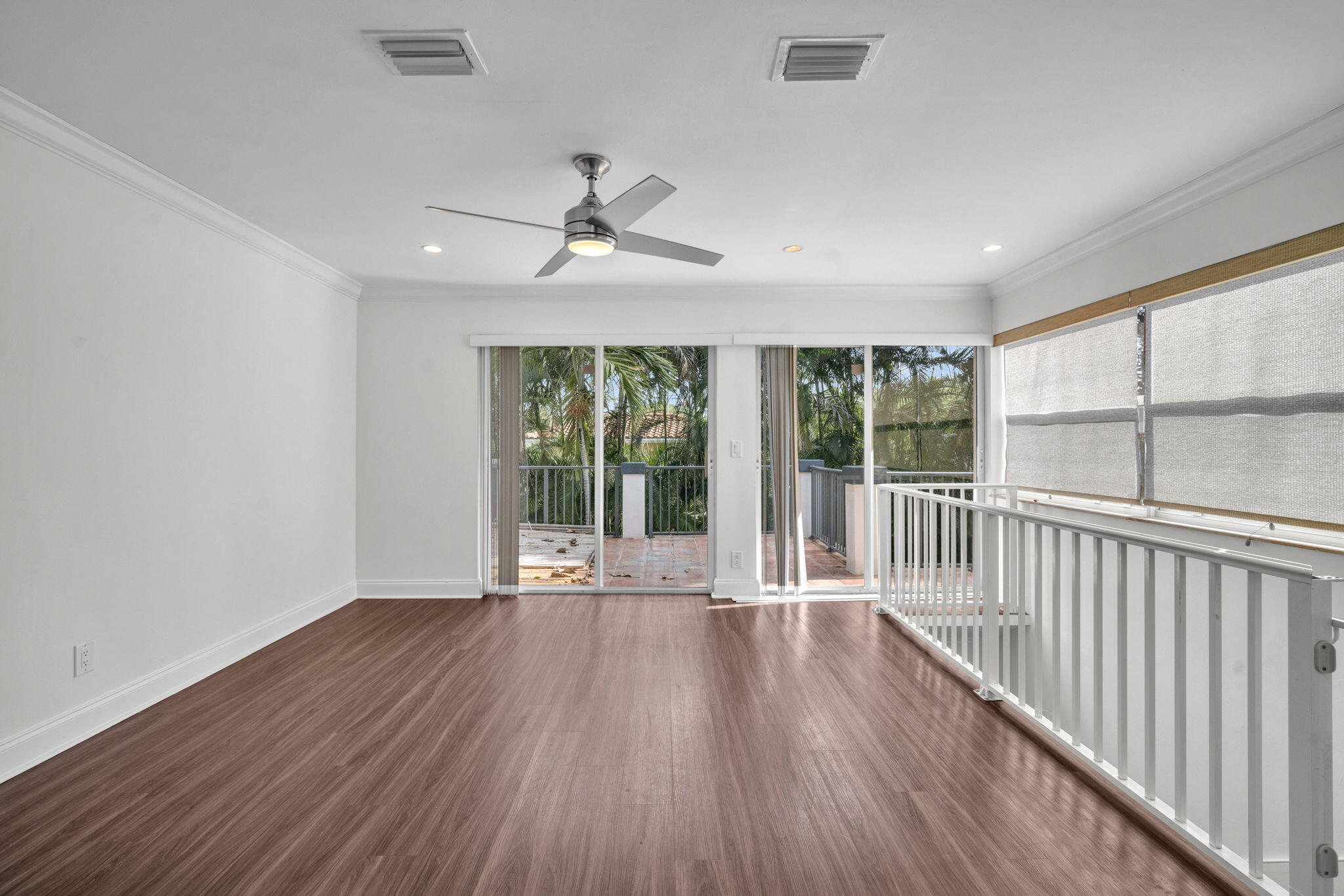 144 Northwest 4th Avenue Boca Raton, FL 33432 - Photo 14 of 35 a view of an empty room with wooden floor and a window