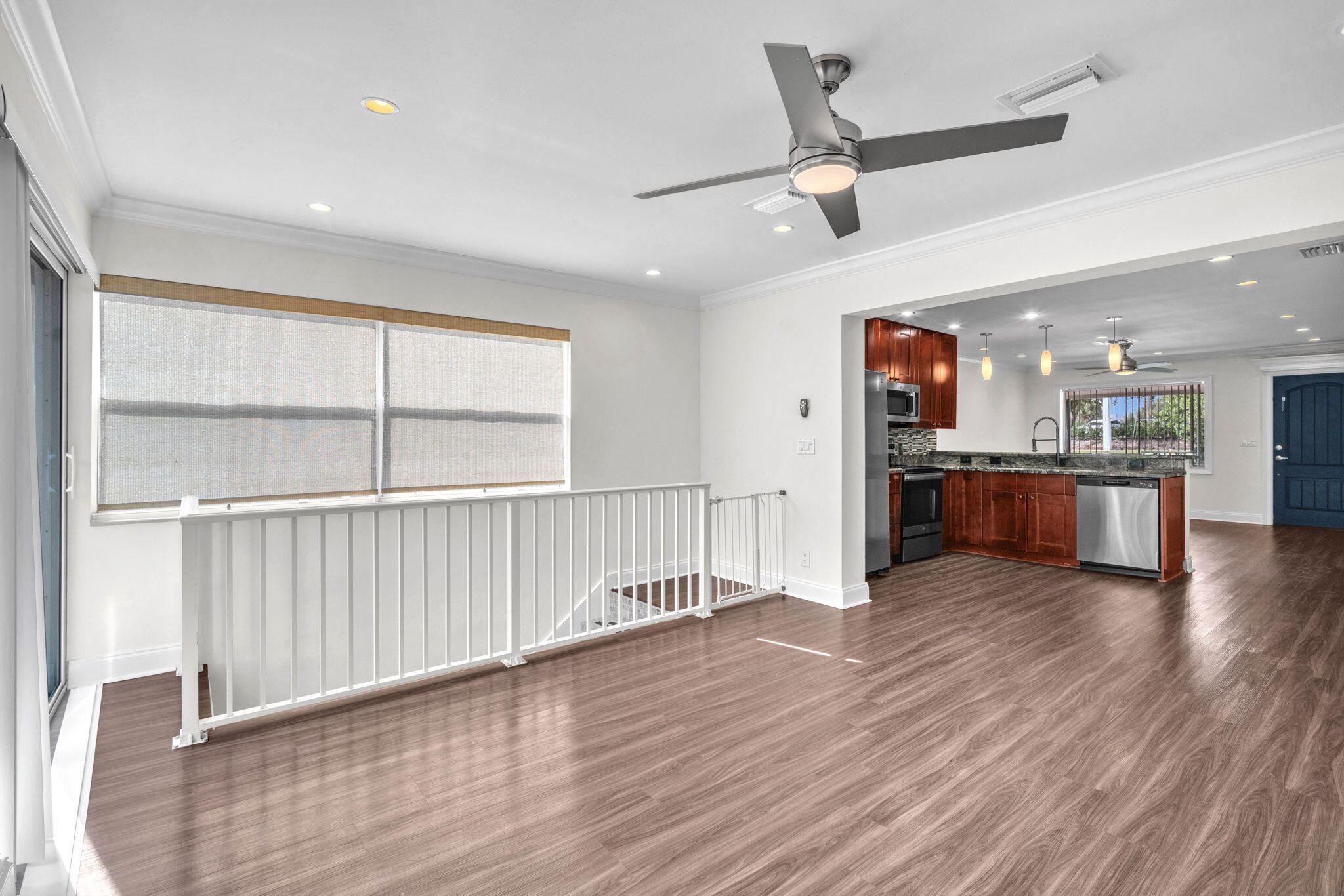 144 Northwest 4th Avenue Boca Raton, FL 33432 - Photo 16 of 35 a view of kitchen with wooden floor and window
