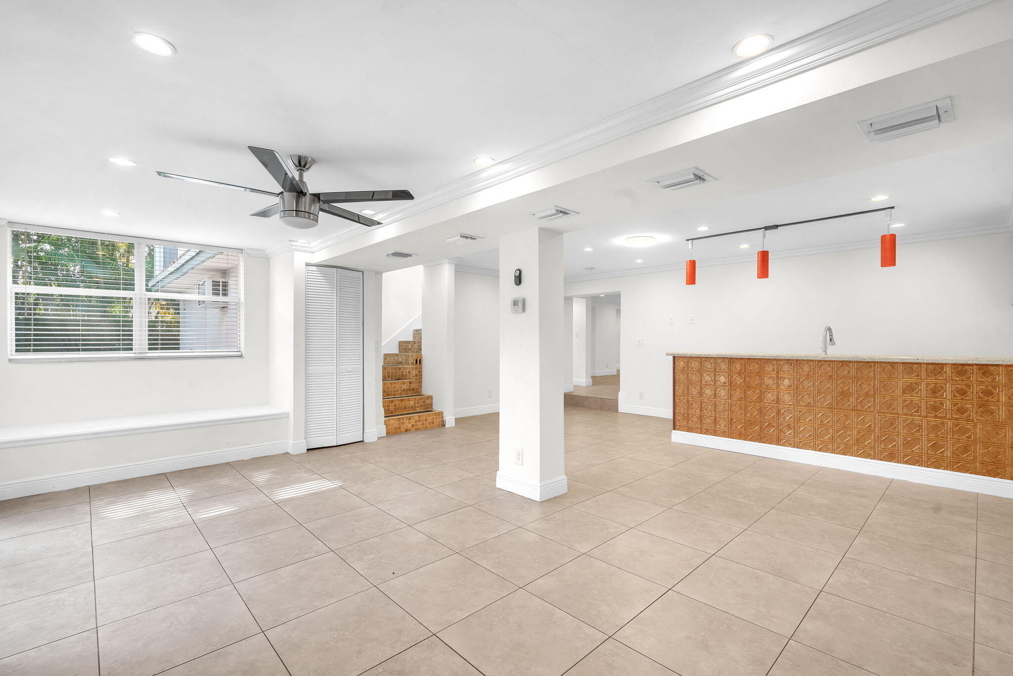 144 Northwest 4th Avenue Boca Raton, FL 33432 - Photo 21 of 35 a view of a livingroom with a ceiling fan and window