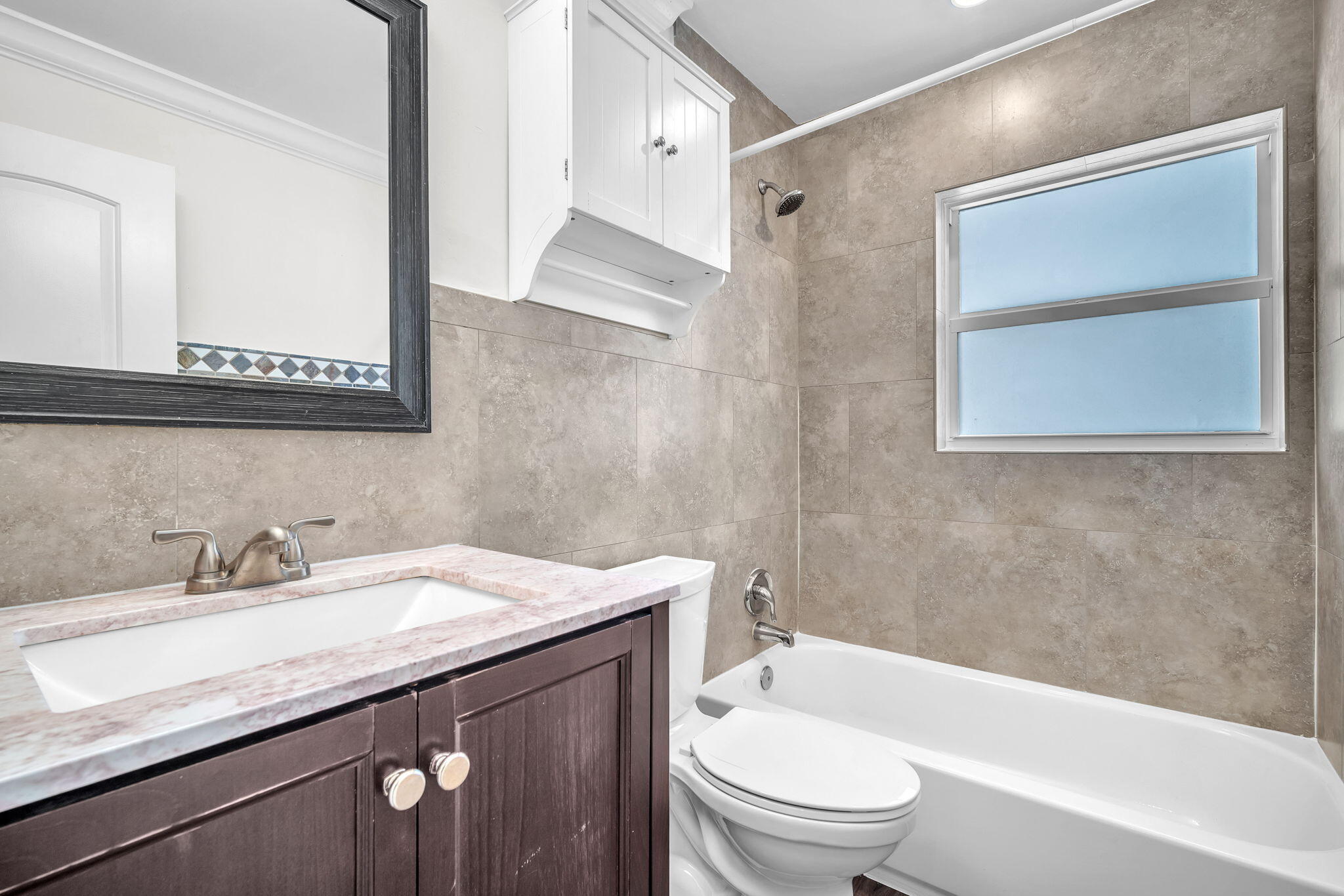 144 Northwest 4th Avenue Boca Raton, FL 33432 - Photo 29 of 35 a bathroom with a granite countertop sink toilet and shower