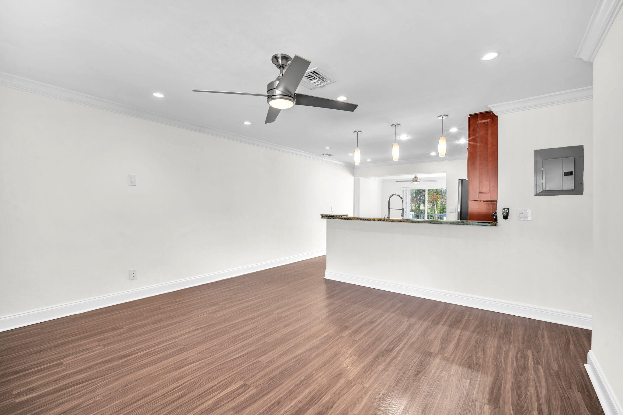 144 Northwest 4th Avenue Boca Raton, FL 33432 - Photo 10 of 35 a view of a kitchen with a dishwasher and a wooden floor