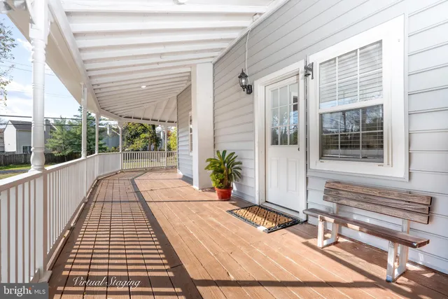 a view of a balcony with wooden floor