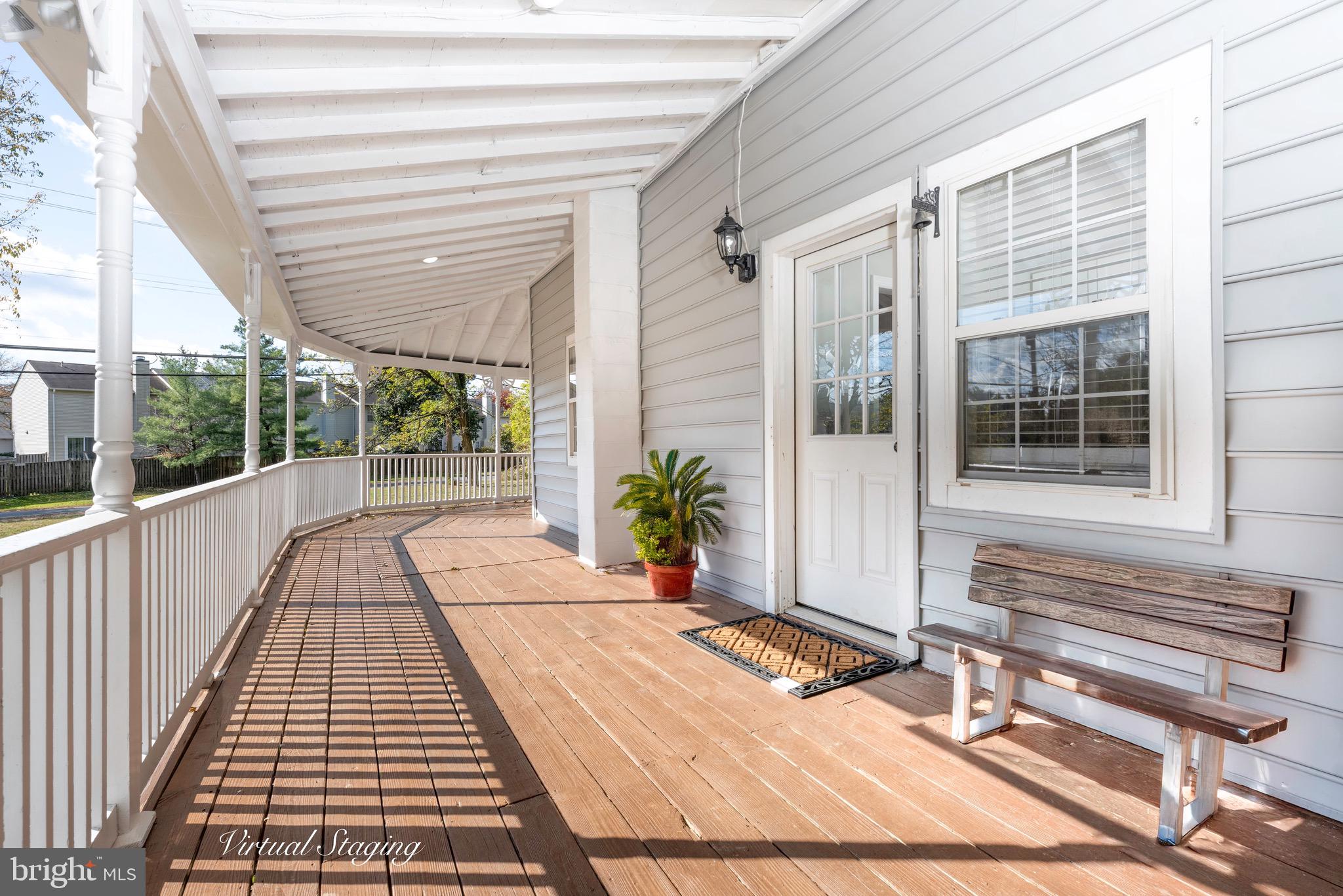 8547 Emory Grove Road Gaithersburg, MD 20877 - Photo 2 of 14 a view of a balcony with wooden floor