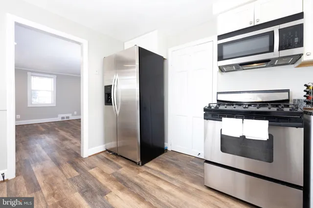 a kitchen with a stove and a microwave