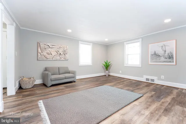 a living room with furniture and window