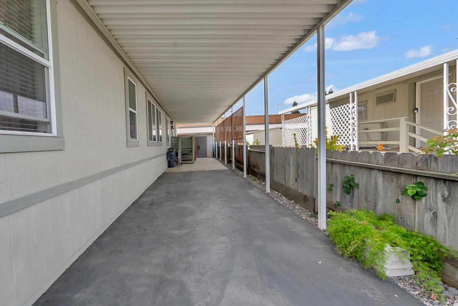 1459 Standiford, Unit 92 Modesto, CA 95350 - Photo 4 of 19 a view of a porch with wooden stairs