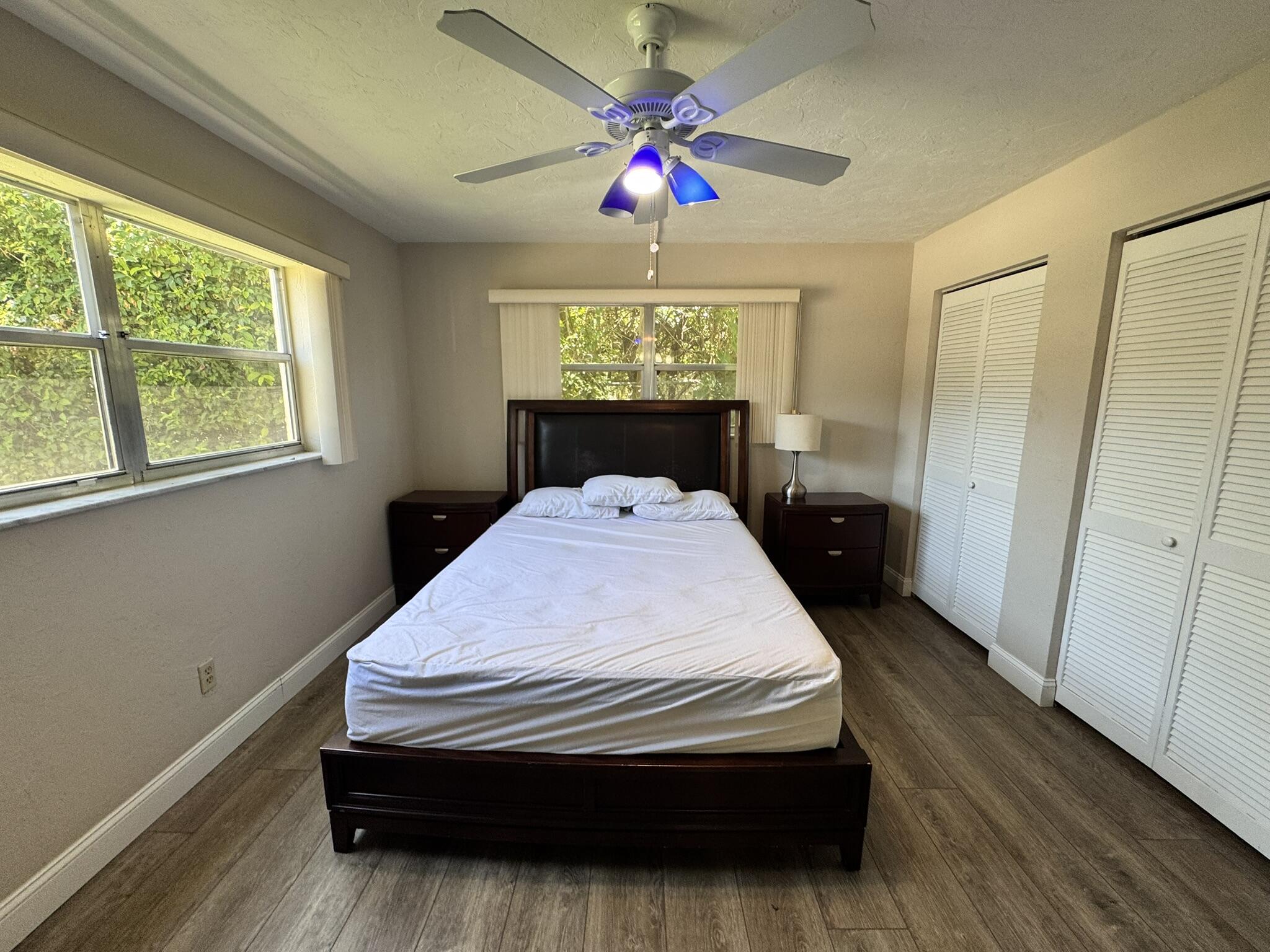 3124 Highway 441, Unit J1 Okeechobee, FL 34974 - Photo 18 of 40 a bed sitting in a bedroom next to a window