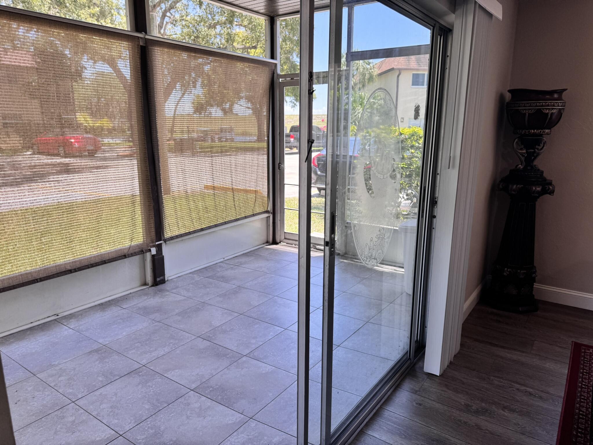 3124 Highway 441, Unit J1 Okeechobee, FL 34974 - Photo 22 of 40 a view of empty room with wooden floor and windows