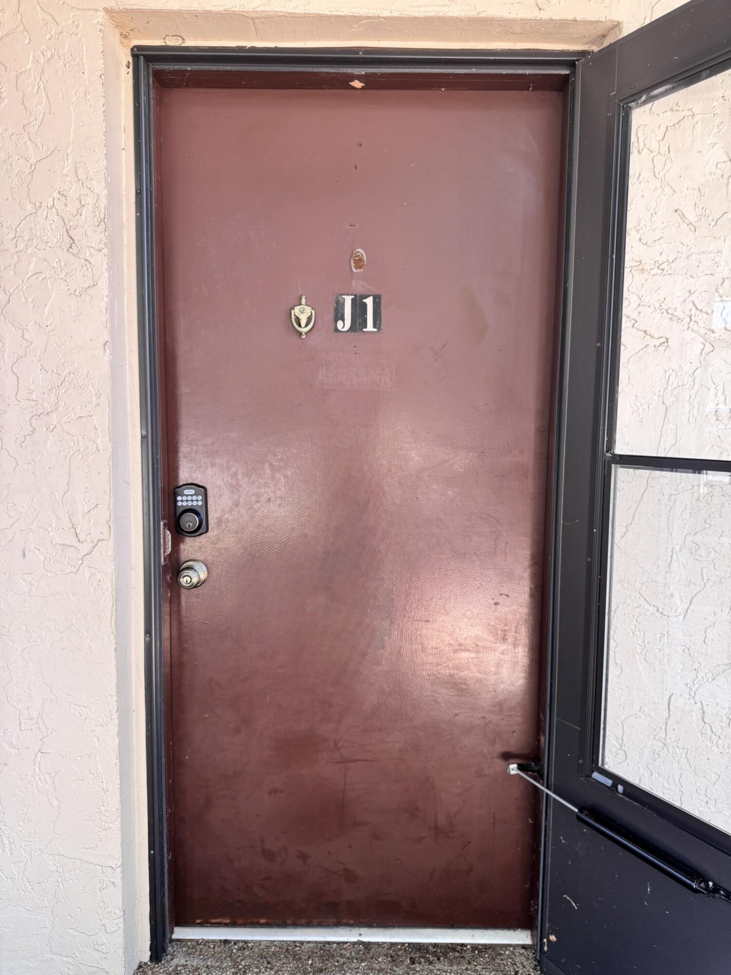 3124 Highway 441, Unit J1 Okeechobee, FL 34974 - Photo 28 of 40 view of a door