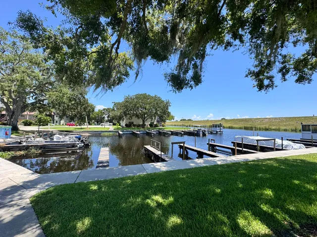 a view of a lake with houses in the back