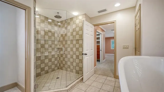a view of a porch with furniture and a yard