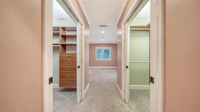 a view of a patio with table and chairs and potted plants