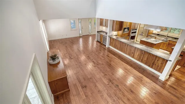 a view of a chairs and table in patio with a barbeque grill