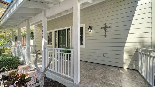 a view of empty room with wooden floor and windows