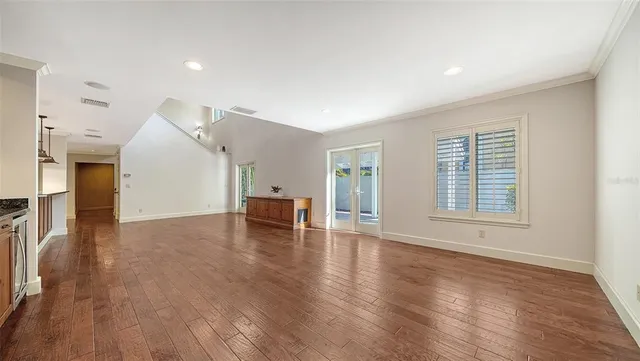 a view of hallway with wooden floor