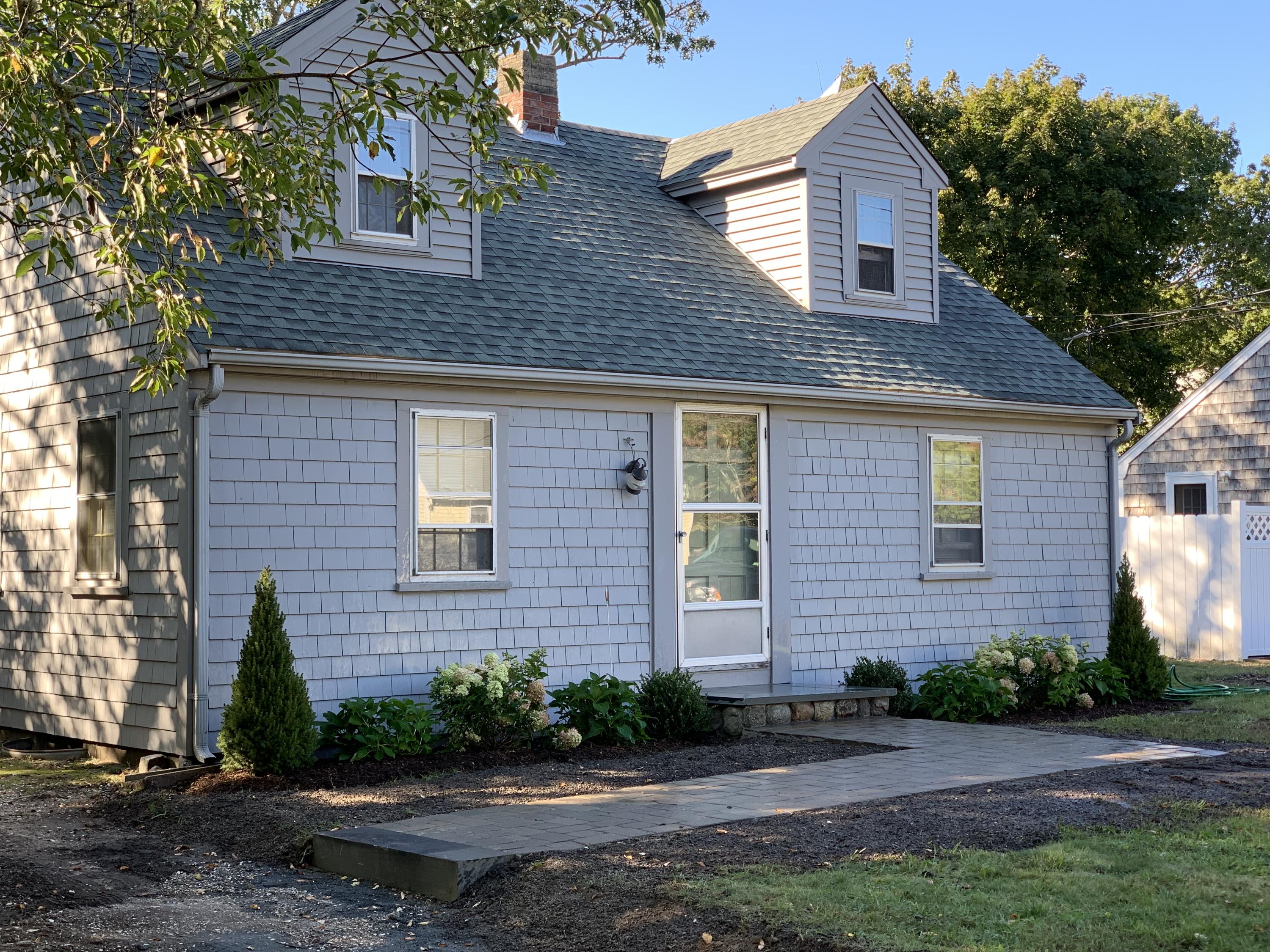 7 Brookshire Road Hyannis, MA 02601 - Photo 4 of 13 a front view of a house with a yard