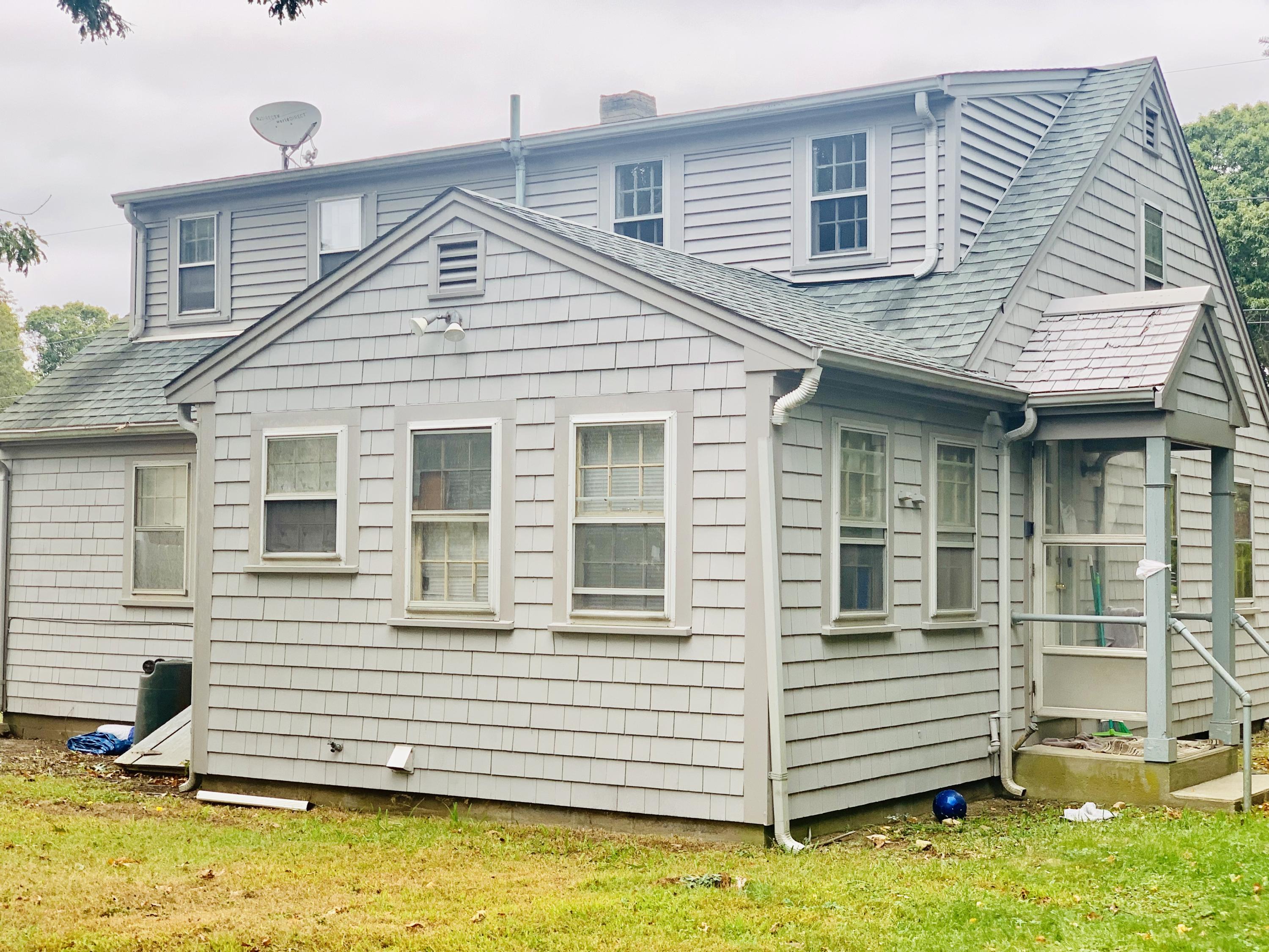 7 Brookshire Road Hyannis, MA 02601 - Photo 6 of 13 a view of a house with a roof deck