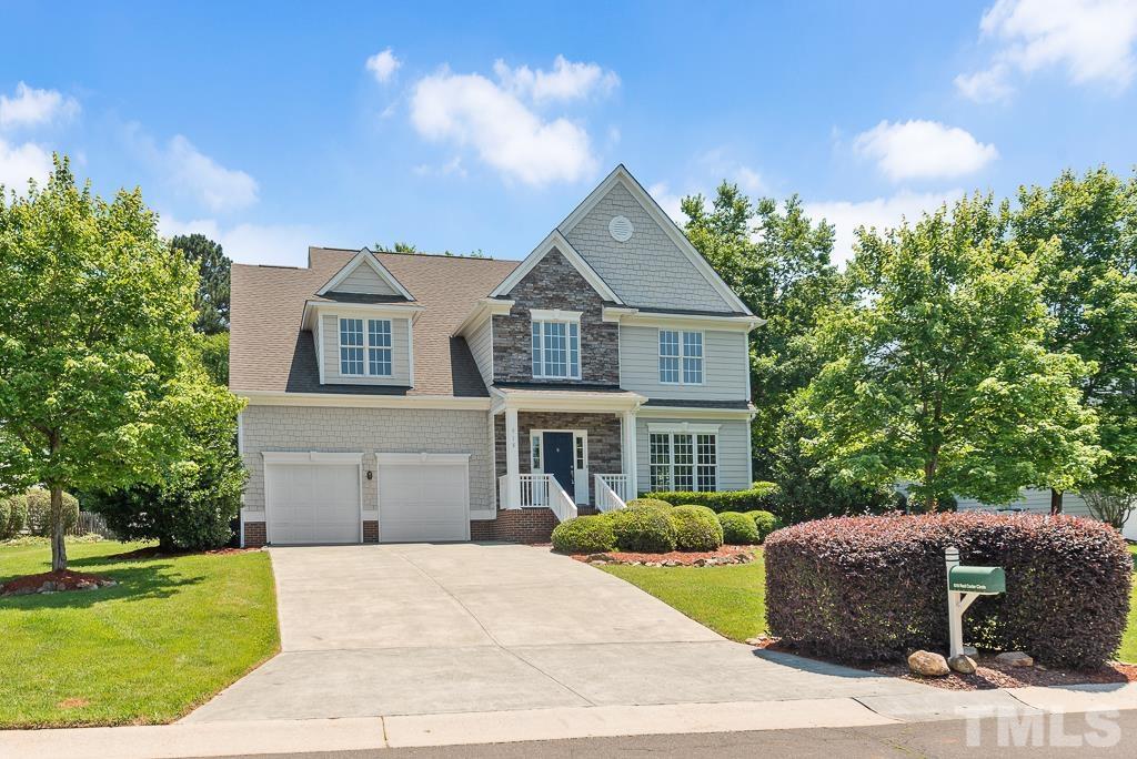 618 Red Cedar Circle Durham, NC 27712 - Photo 1 of 45 a front view of a house with a garden