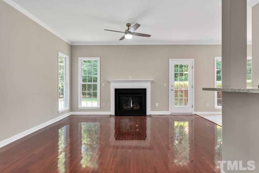 618 Red Cedar Circle Durham, NC 27712 - Photo 13 of 45 a view of an empty room with wooden floor and a window