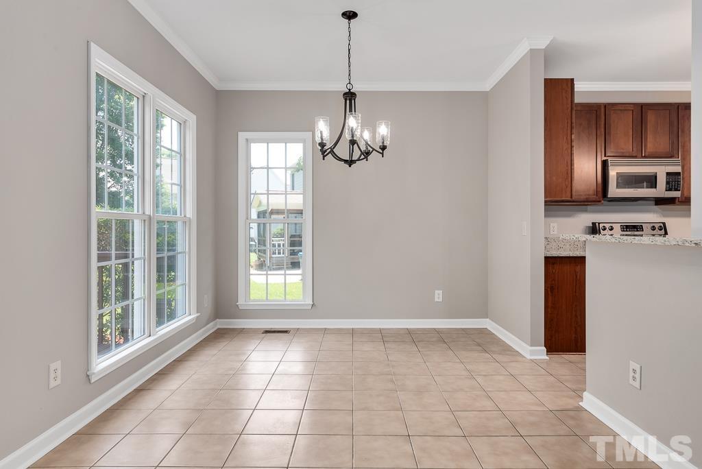 618 Red Cedar Circle Durham, NC 27712 - Photo 16 of 45 a view of a kitchen with an empty space and a window