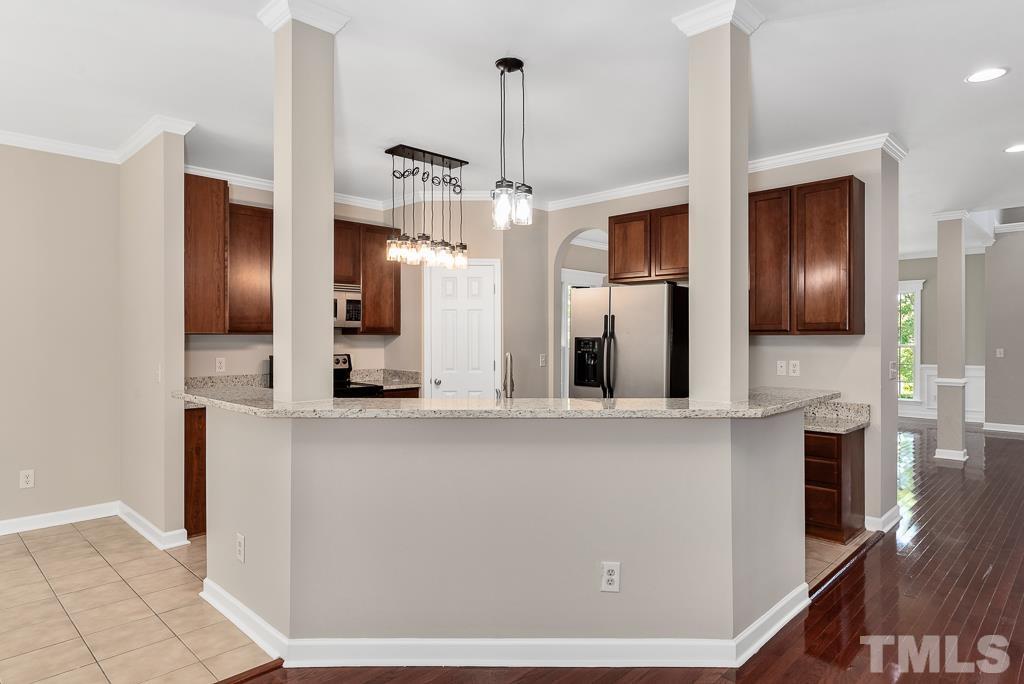 618 Red Cedar Circle Durham, NC 27712 - Photo 17 of 45 a kitchen with stainless steel appliances a refrigerator and microwave