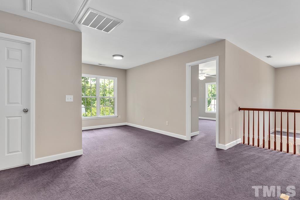 618 Red Cedar Circle Durham, NC 27712 - Photo 23 of 45 an empty room with windows and closet