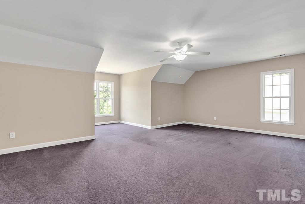 618 Red Cedar Circle Durham, NC 27712 - Photo 25 of 45 an empty room with windows and fan
