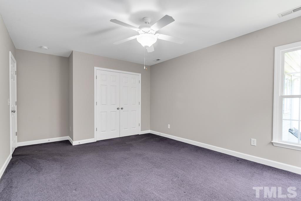 618 Red Cedar Circle Durham, NC 27712 - Photo 31 of 45 an empty room with windows and ceiling fan