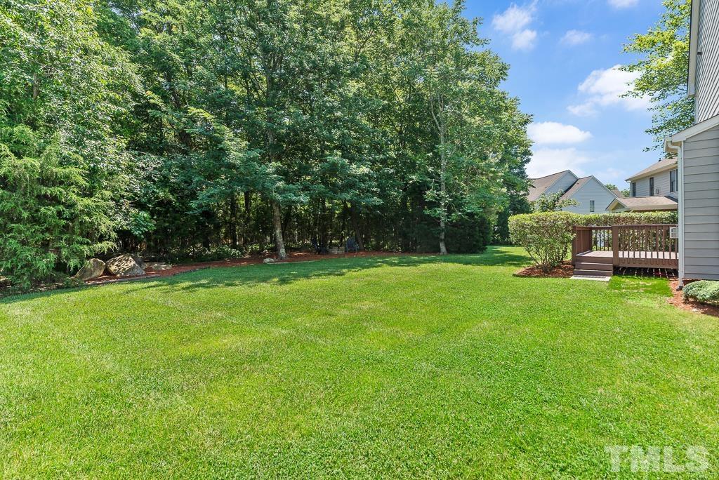 618 Red Cedar Circle Durham, NC 27712 - Photo 37 of 45 a view of a garden with a bench