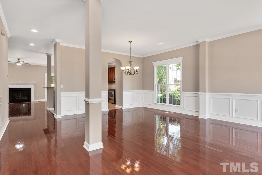 618 Red Cedar Circle Durham, NC 27712 - Photo 8 of 45 a view of a living room with wooden floor and a window