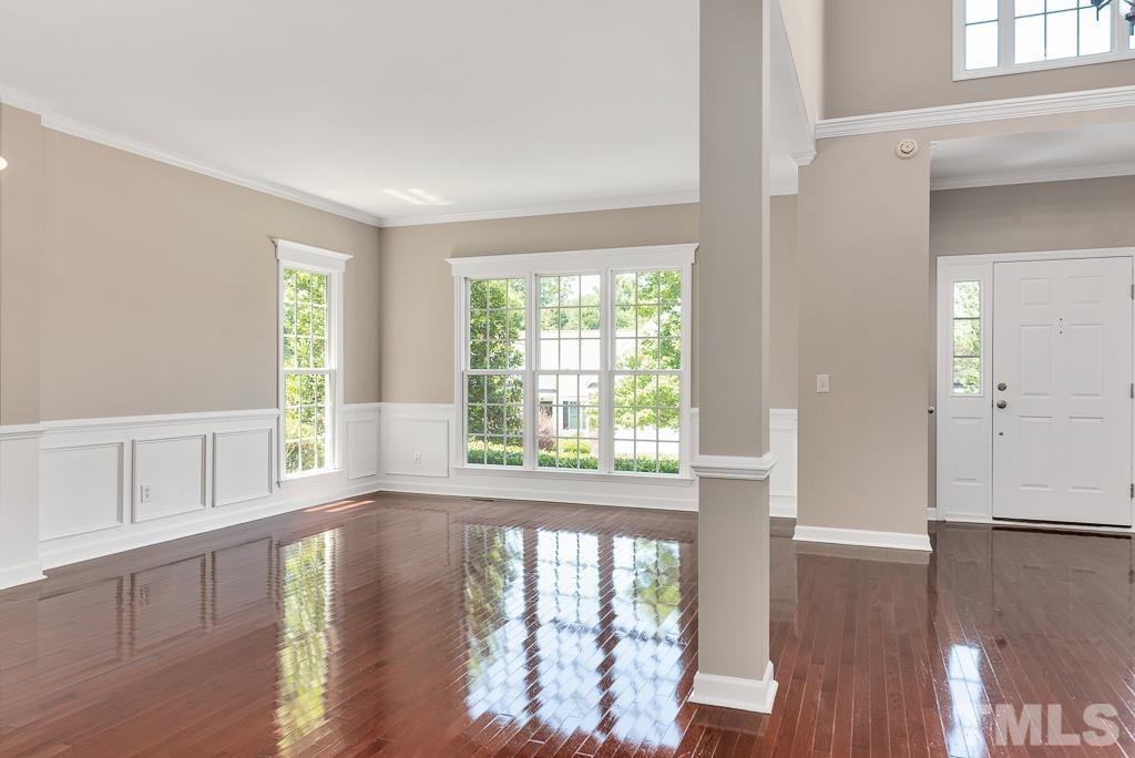 618 Red Cedar Circle Durham, NC 27712 - Photo 10 of 45 a view of an empty room with wooden floor and a window