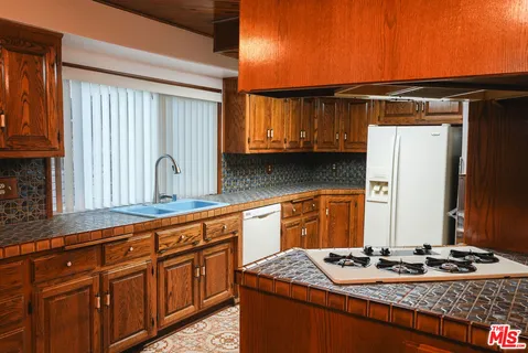 a view of dining room with furniture wooden floor and chandelier