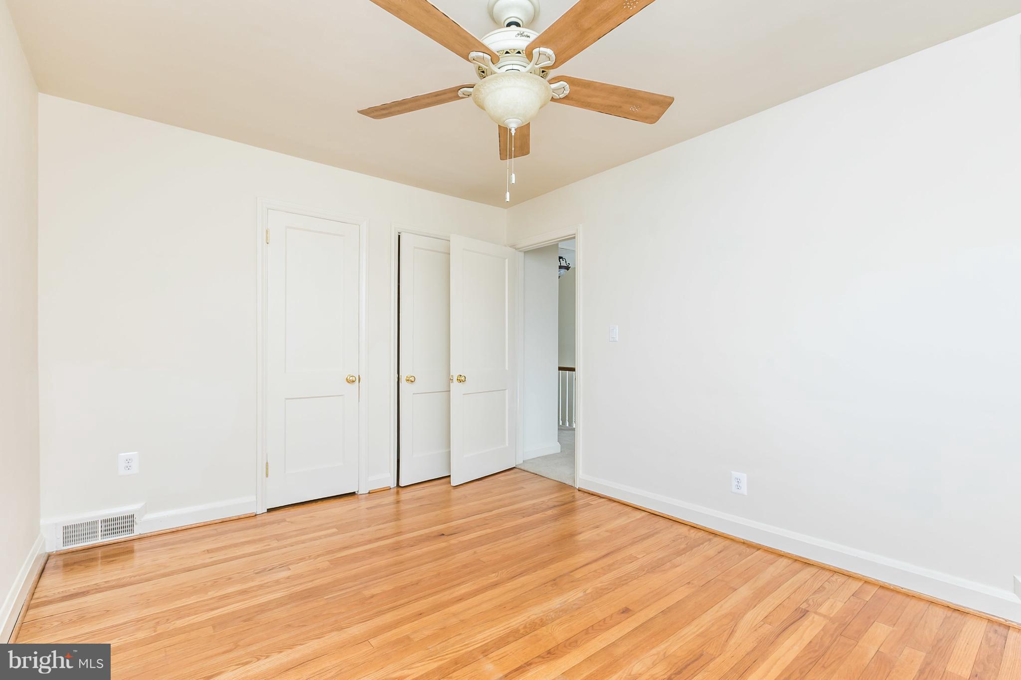 1872 Edgewood Road Towson, MD 21286 - Photo 12 of 17 a view of empty room with wooden floor and fan