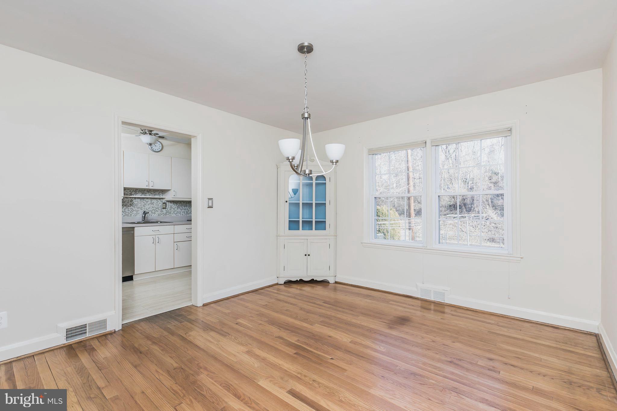 1872 Edgewood Road Towson, MD 21286 - Photo 4 of 17 a view of empty room with wooden floor and window