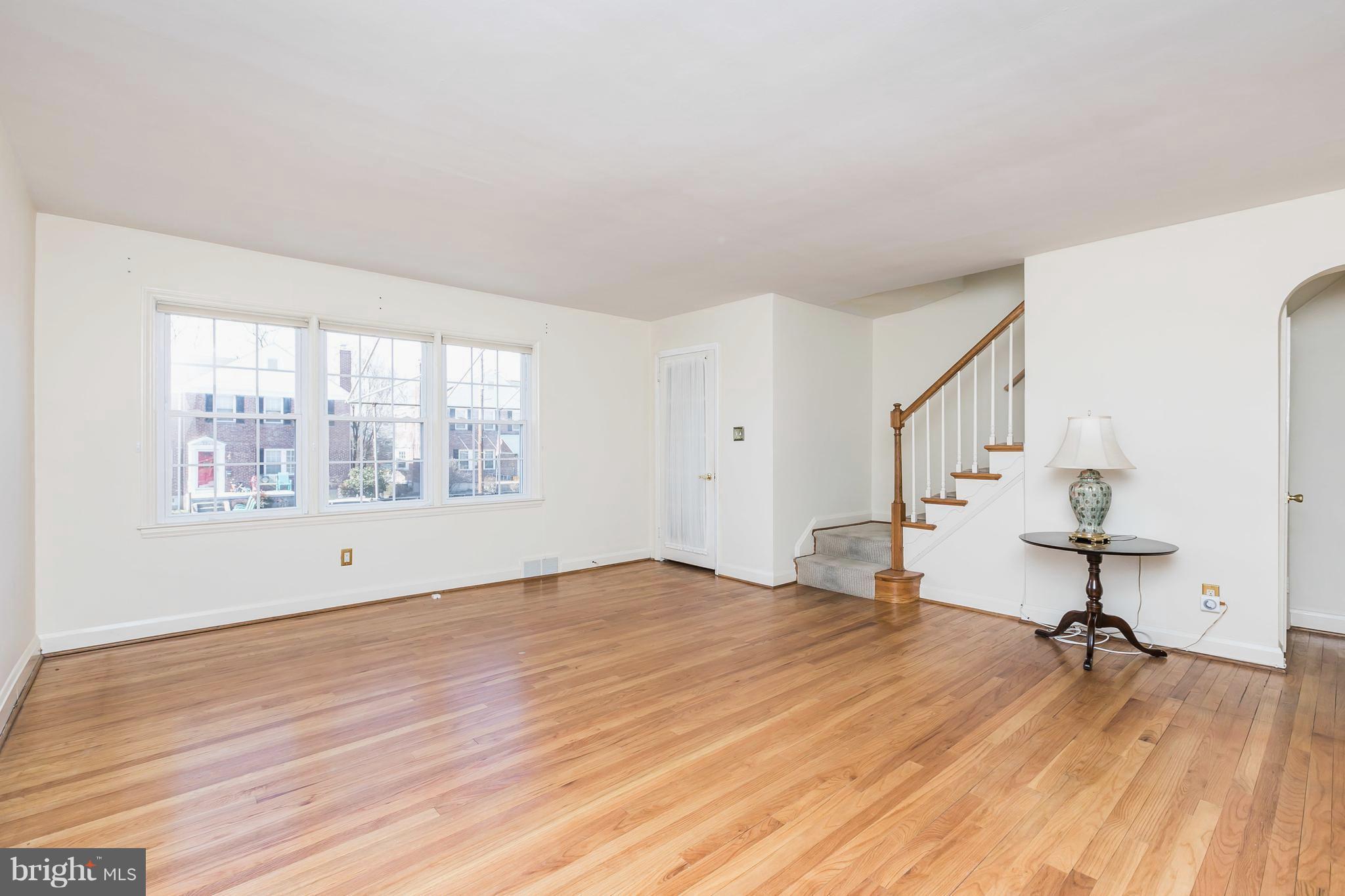 1872 Edgewood Road Towson, MD 21286 - Photo 7 of 17 a view of empty room with a window and wooden floor