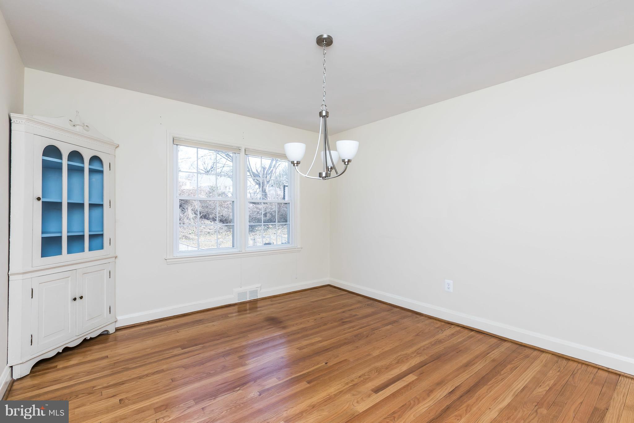 1872 Edgewood Road Towson, MD 21286 - Photo 8 of 17 a view of empty room with wooden floor and fan