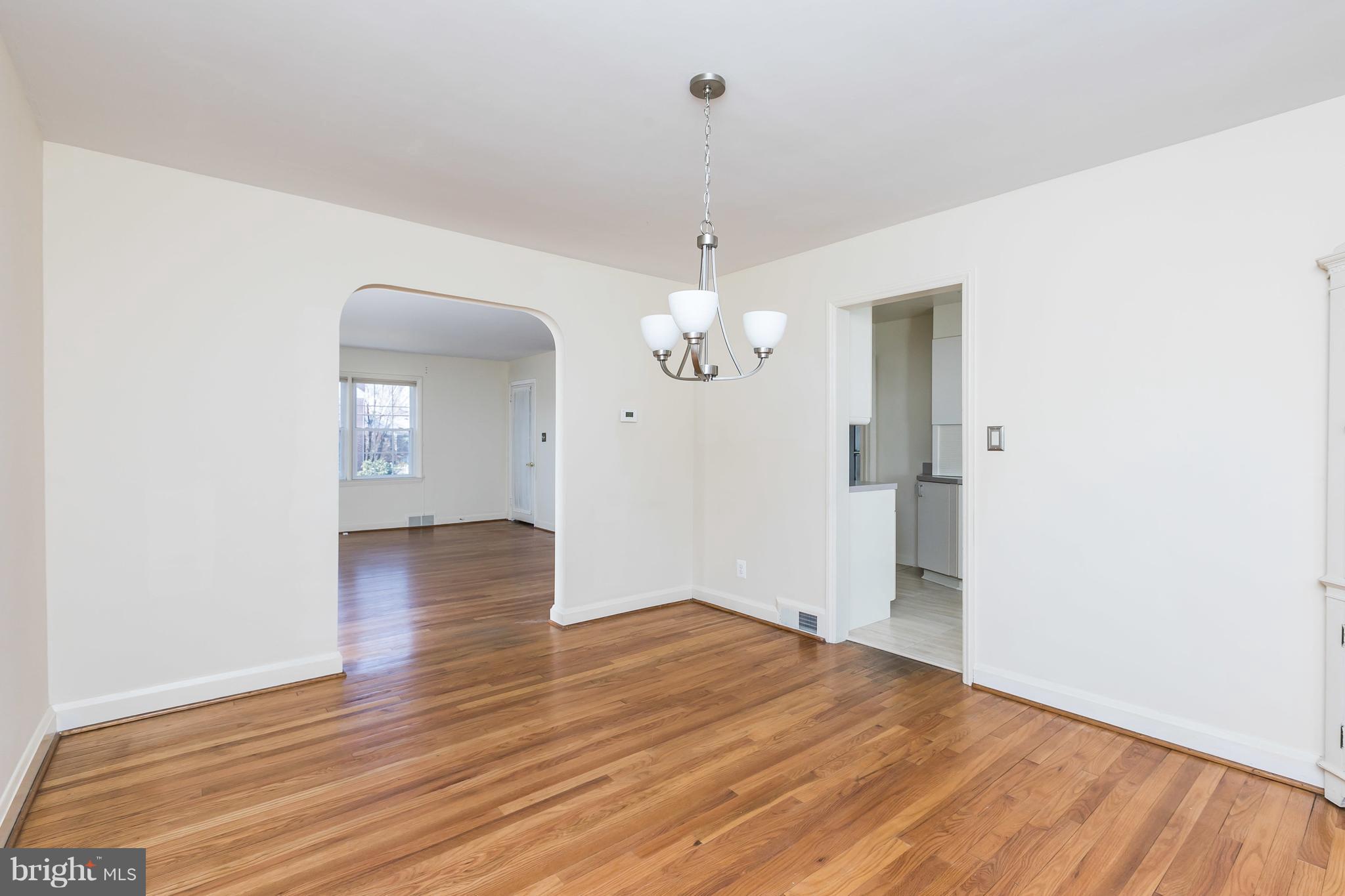1872 Edgewood Road Towson, MD 21286 - Photo 9 of 17 wooden floor in an empty room with a window