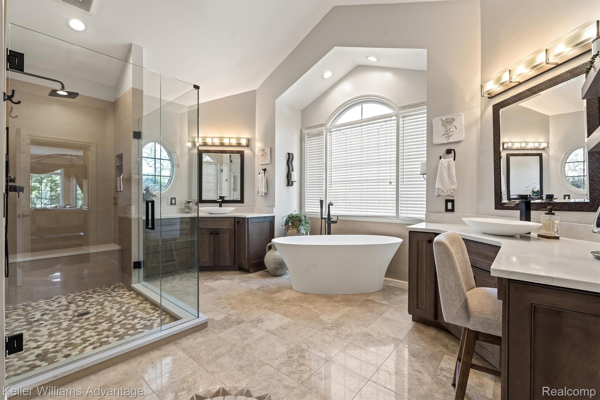22878 Tree Top Court South Lyon, MI 48178 - Photo 20 of 75 Spacious bathroom featuring a frameless glass shower enclosure with pebble-style flooring and a rainfall showerhead