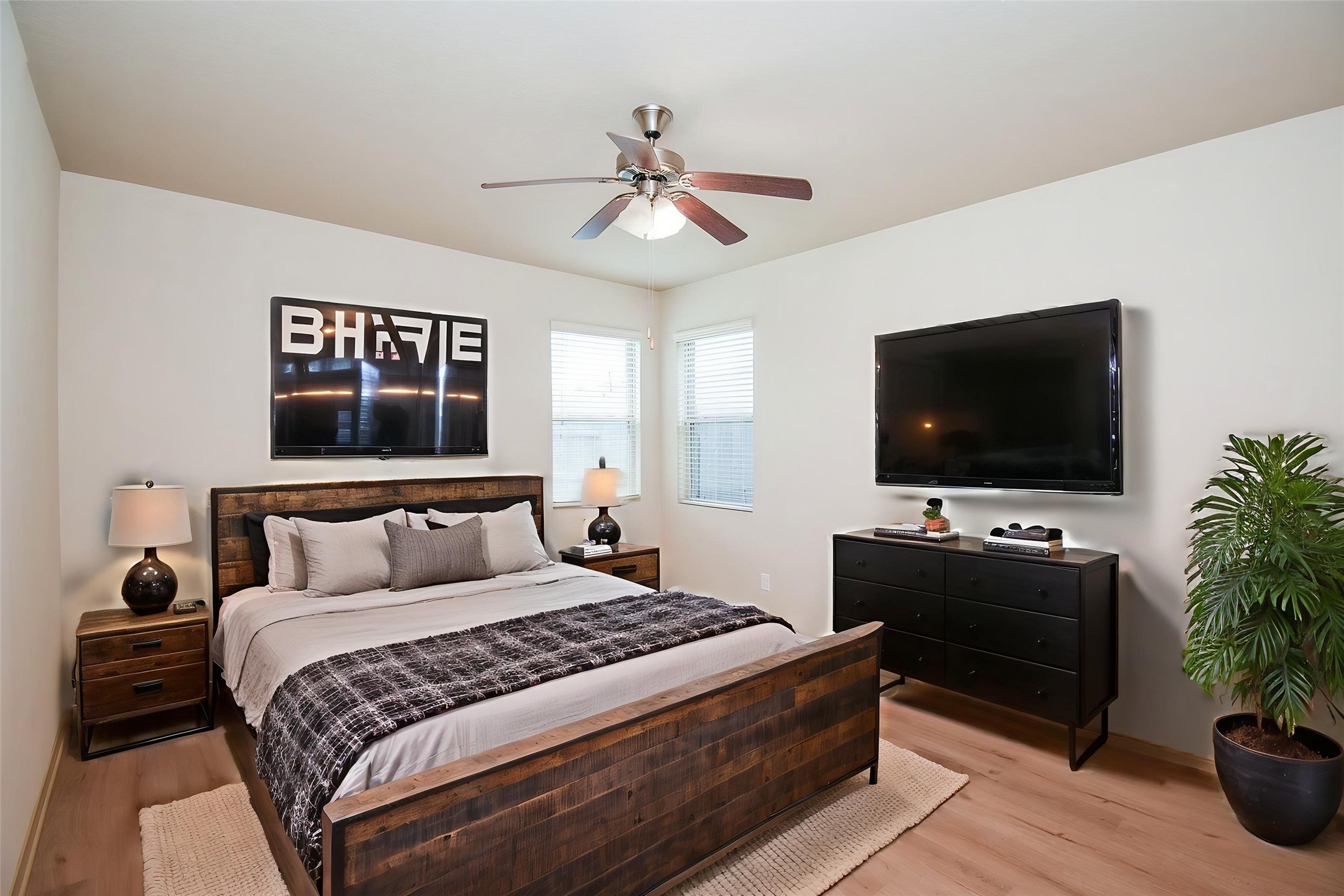 2106 Harmon Crest Court Spring, TX 77373 - Photo 19 of 37 a bedroom with a bed and a flat screen tv