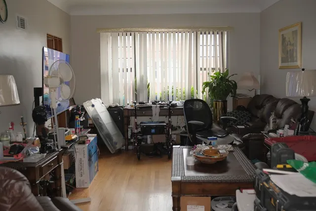 a view of a hallway with wooden floor and stairs