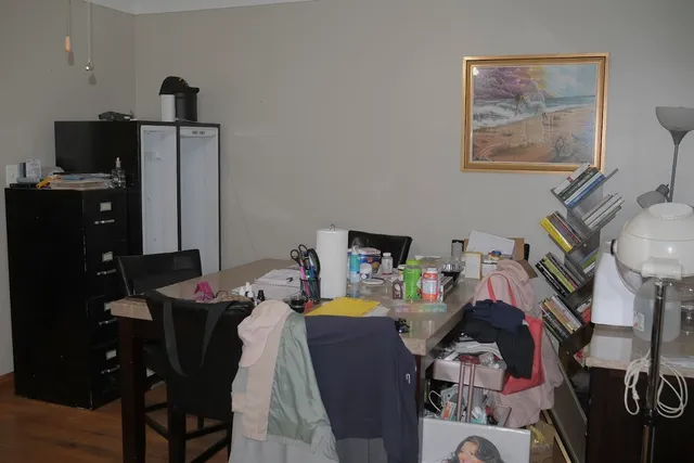 a bathroom with a granite countertop sink a toilet and shower