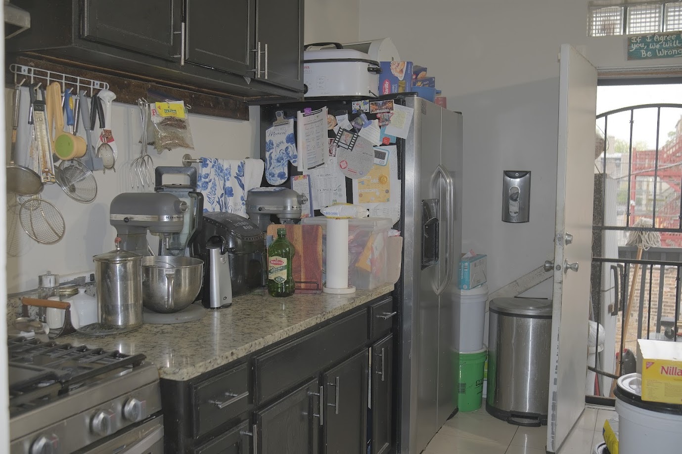 1651 West 79th Street Chicago, IL 60620 - Photo 21 of 29 a kitchen with refrigerator and cabinets