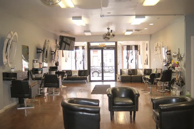 a living room with furniture large window and flat screen tv