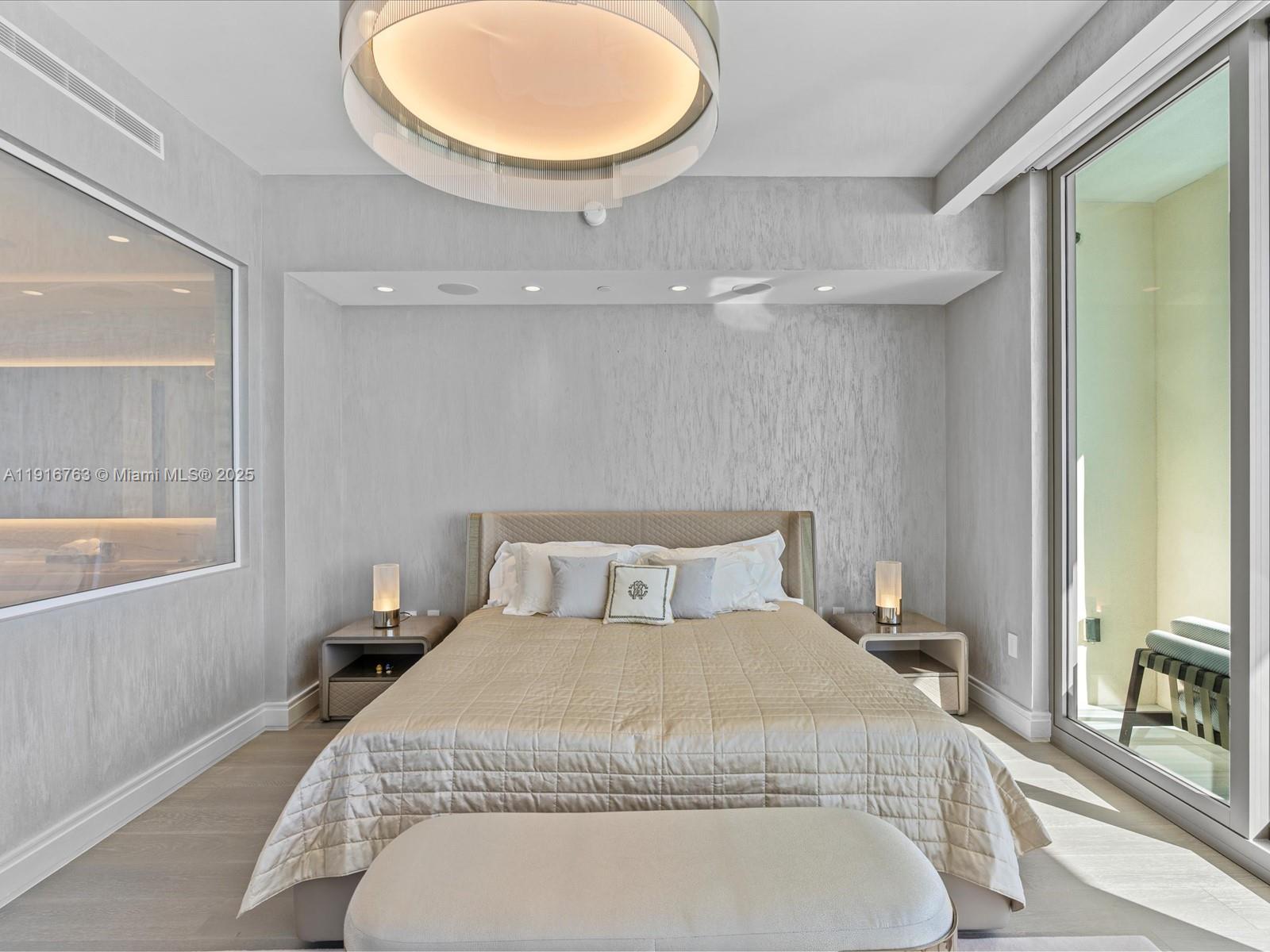 17901 Collins Avenue, Unit 2602 Sunny Isles Beach, FL 33160 - Photo 20 of 85 a bedroom with a bed and window