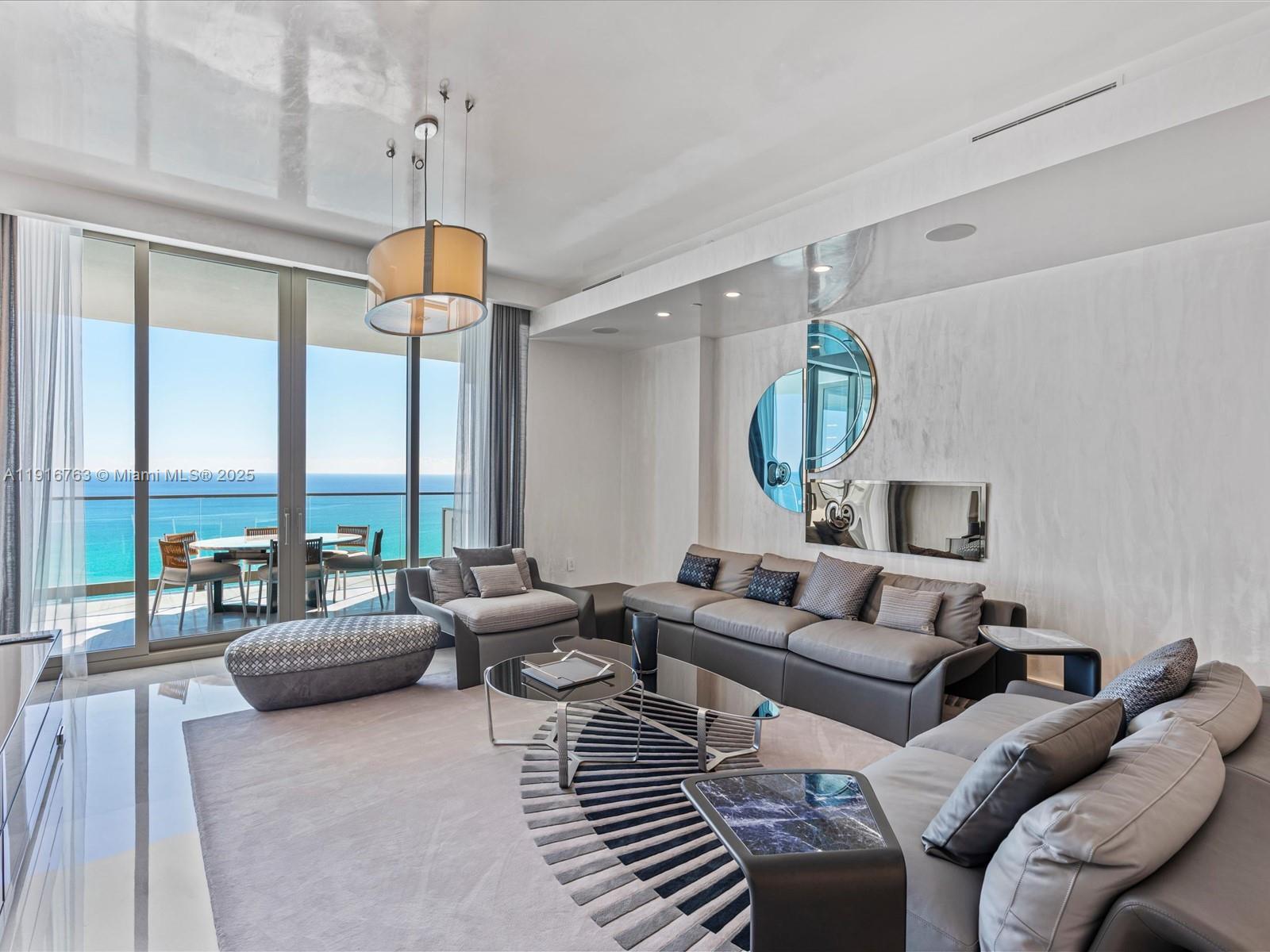 17901 Collins Avenue, Unit 2602 Sunny Isles Beach, FL 33160 - Photo 2 of 85 a living room with furniture and a large window