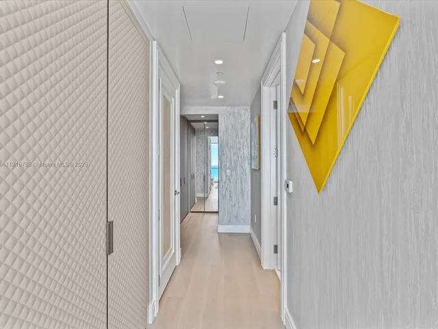 a dining room with furniture and a large window