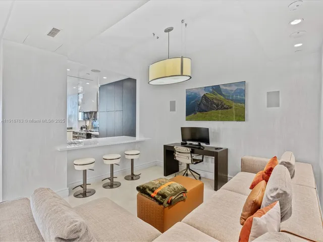 a spacious bedroom with a large bed and a large window