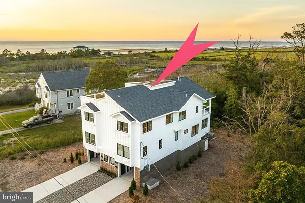 a view of a house with roof deck