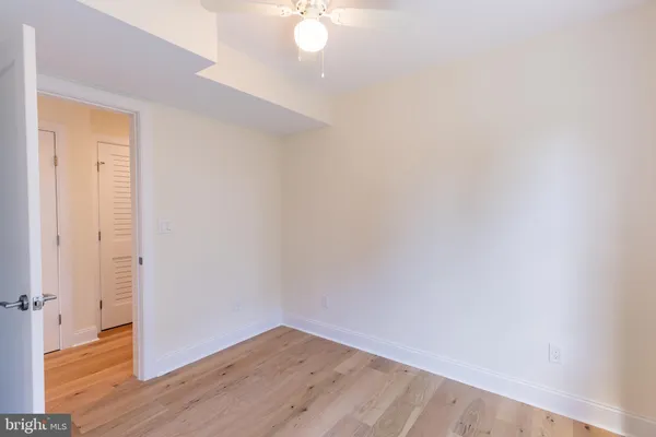 a view of a small space with wooden floor